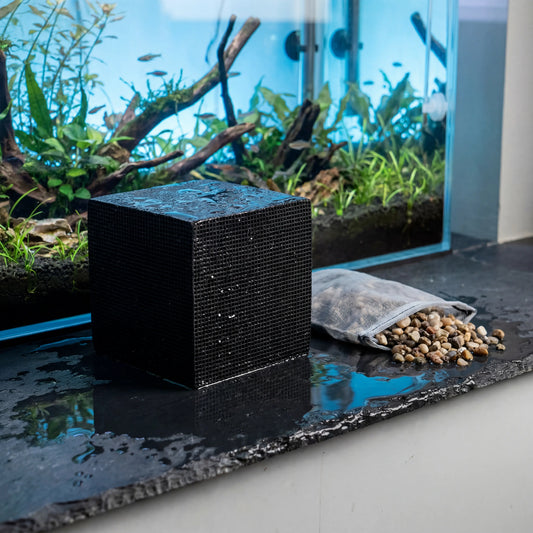 Activated Carbon aquarium filtration media beside aquarium